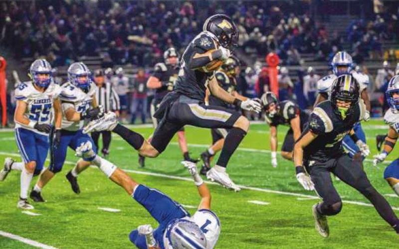 Olentangy Liberty’s strong defense kept the Yellow Jackets out of the endzone and performing aerial leaps to gain yardage.