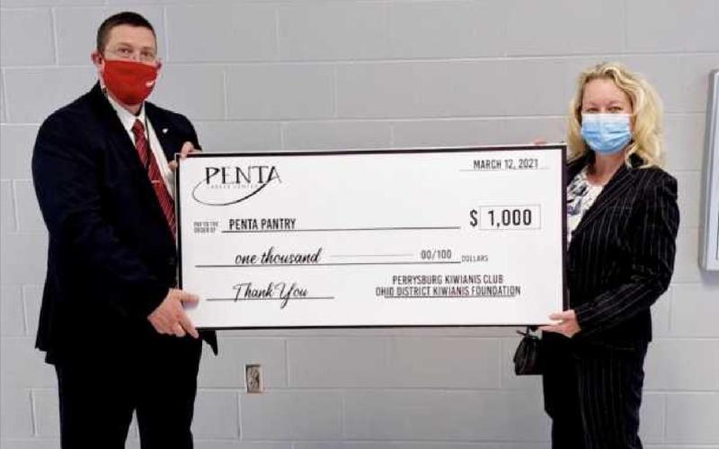 Ed Ewers, Penta superintendent, left, with Susan Snoddy, Kiwanis member, right.