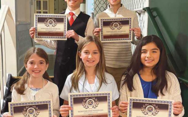 Following are the Perrysburg Exchange Club Patriotism Award winners: front, from left, Lena Coulson, Charley Smith, Charlotte Talbert; back, Levi Reddick and Ben Geha.