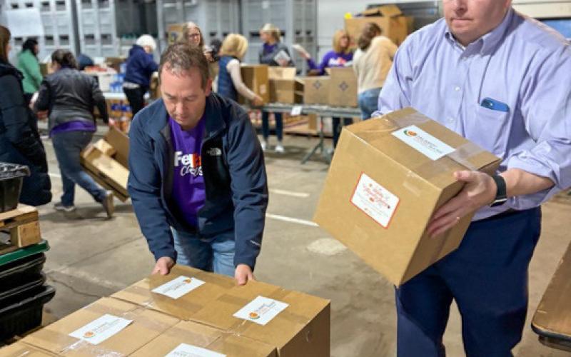 Volunteers assembled the holiday food boxes.
