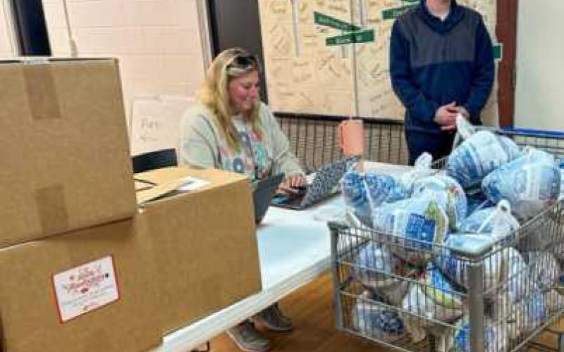 Seventy-five food boxes and turkey breasts were distributed to area families.