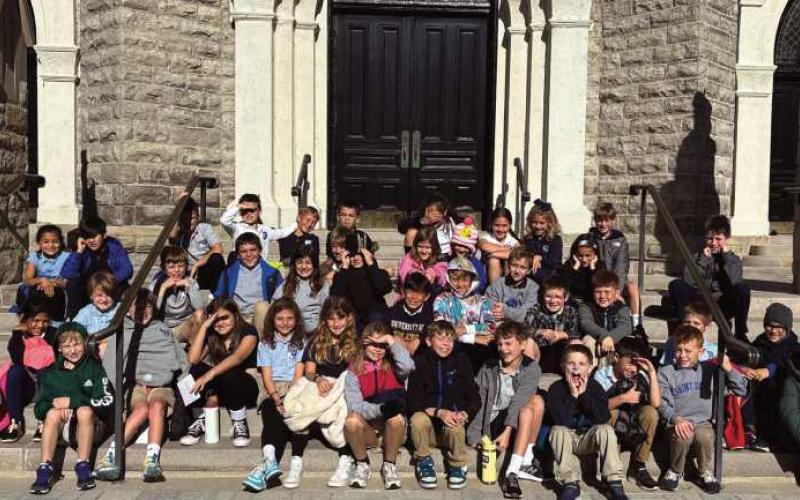 Saint Rose third grade students recently completed a walking tour of historic Perrysburg. They were assigned different historical buildings around Perrysburg. They conducted research about the building and the early founders. In mid-October, they then explored Perrysburg with their teachers. Each student shared his or her research information with classmates in front of each building. The beautiful weather made for a very pleasant day to learn about the history of the community.
