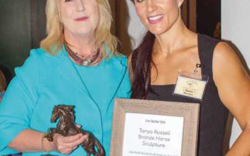 Lissa Guyton and Healing Barn Manager Corri Mayo, before bidding started on the Tanya Russell horse sculpture.