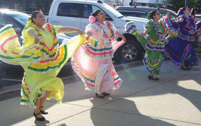 Performers from “El Corazon de Mexico” dance in front of Lupita’s Cantina on Louisiana Avenue.