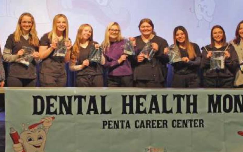 Seniors in Penta’s dental assistant program presented sessions on the importance of oral hygiene to fellow classmates as part of National Children’s Dental Health Month. From left are Brenda Strauss, dental assistant program instructor; Jaycee Snyder, Erin Bouk, Abigail Lipinski, Brie’Ahna Nigh of Springfield Schools, Lela Weiss, Gabby Lockwood, Mackenzie Neal and Nicole Lingle, English instructor.