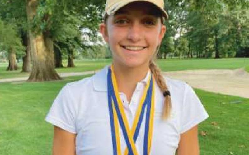 Sydney with two medals from a previous contest.