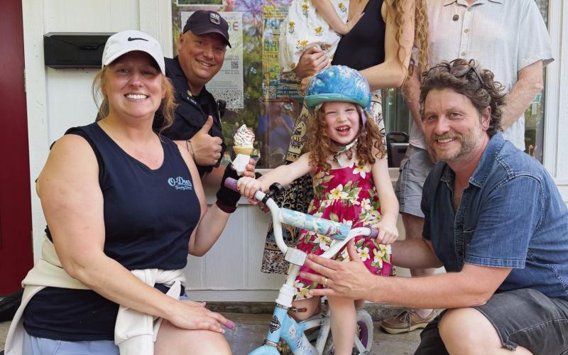 From left, back row: Officer Greg Cole, mom Emily Schooler holding Josie and Mayor Mark Weber. Front row: O-Deer Diner owner Alexa Farley, Shiloh Schooler and her dad Chris Schooler.