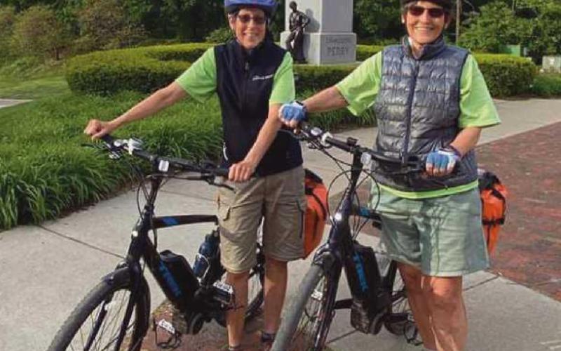 Cathie Rowand, left, and Kathi Weiss near the Commodore Perry statue during their stop in Perrysburg.