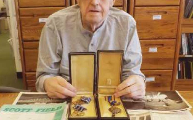 Jack McPherson with Dale Thompson’s Air Medal and Distinguished Flying Cross.
