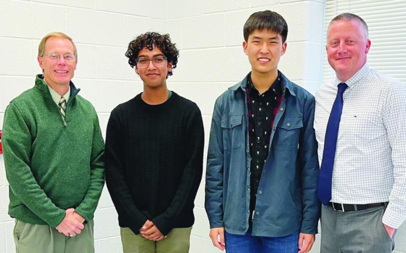 PHS Class of 2023 Salutatorian Nikhil Methi and Valedictorian Andrew Chung with Ray Pohlman and Principal Aaron Cookson.