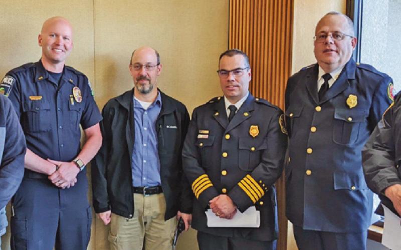 Local first responders joined their counterparts across Wood County to ask the commissioners to fund a $3.4 million countywide computer aided dispatch system. From left are Rossford Police Chief Todd Kitzler, Perrysburg Police Chief Patrick Jones, Perrysburg Township Sergeant Scott Moskowitz, Perrysburg Township Deputy Fire Chief Jim Rodriguez, Fire Chief Tom Brice and township police Lieutenant David Nixon.