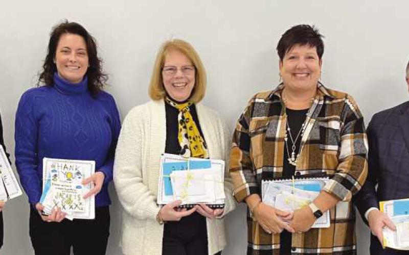 School board members, from left, Susan Rowland Miller, Laura Meinke, Sue Larimer, Vice President Lori Reffert and President Eric Benington.