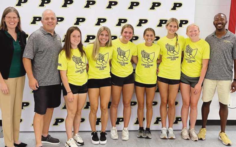 From left are board of education member Susan Rowland Miller, Coach Jon Monheim, Emma Ogdahl, Elyza Byrd, McKenna Conley, Ava Kincaid, Hannah Kersten, Natalie Sanders and Coach Darryl Edge. Team members not pictured are Camille Francis, Kinsley Jones, Ava Beeks, Laura Valette.