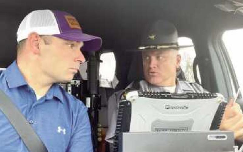 Rep. Ghanbari sits in the front seat of a patrol car last summer during a ride-along with Ohio Highway Patrol Trooper Casimir Von Sacken in Bowling Green during an overnight shift.