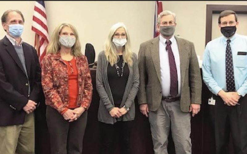From left: Mike Godfrey, Sallie Gardner, Linda Hammer and Steve Heckler with Judge Woessner.