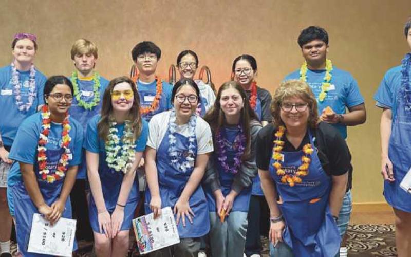 Members of the Perrysburg High School Interact Club assisted the Perrysburg Rotary Club at its April 25 fund-raiser. Pictured are, front row, from left: Kivani Govender, Scarlett McClain, Cindy Ma, Layelle Allamar and Terri Camp, Perrysburg High School Interact coordinator. Back row: Ju’Don Pratt, Katie Avery, Andrew Garst, Brian Chen, Kate Wu, Ling Chen, Kylesh Govender and Alan Chen.