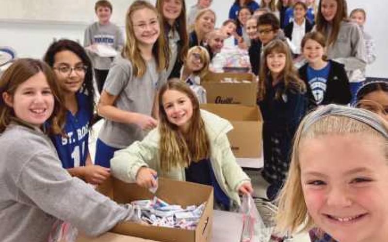 Saint Rose School recently held a supply collection drive to donate to a medical mission to Ukraine. Dr. George Namay and Dr. Brett Pelok also provided personal dental supplies. Students created inspiring cards and packaged up the supplies. More than 200 kits were made.