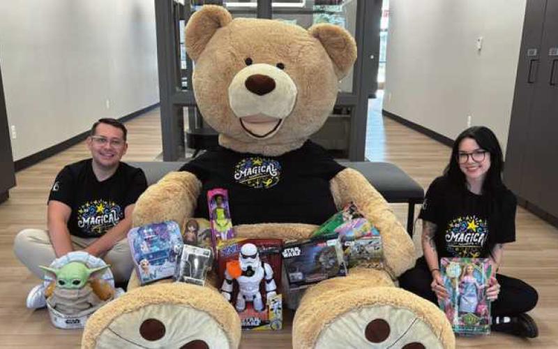 CCF employees Nick Parrino and Nicolette DeRespino pose with Freddy the Teddy and toy donations. Photo taken by Grace Alaska.
