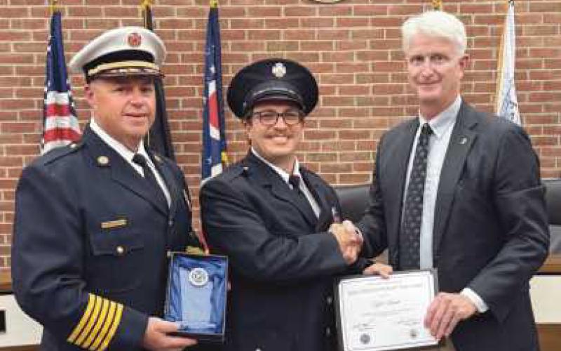 From left, Chief McCullough, firefighter-paramedic Simok and Mayor Mackin.