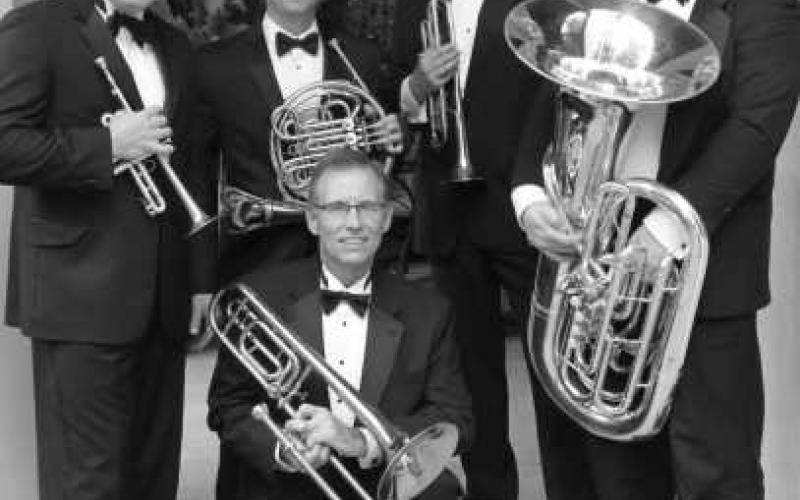 Academy Brass Quintet members pictured with their instruments.