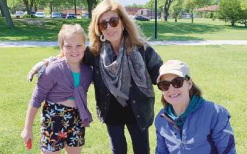Rien Gryczewski, Lynne Barefoot, and Eileen Lyons planted Columbine flowers in the new garden.