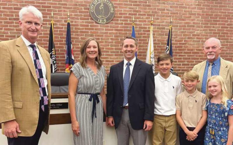 From left, Mayor Mackin, Jane Fawcett, Joe Fawcett, children Daniel, Patrick and Molly Fawcett, and Kevin King.