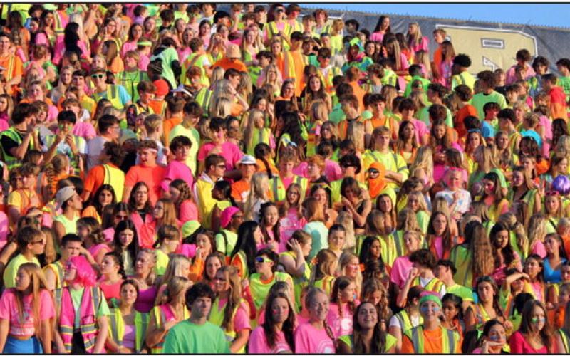 Above, Perrysburg students filled the stands with color in their neon spirit wear. Below, members of the 2023 Homecoming Court are pictured after the crowning of Homecoming queen and king, Sydney Daudelin and Jack Bowe. The royalty received their crowns from last year’s queen and king, Maci Maxwell and Andrew Becks.