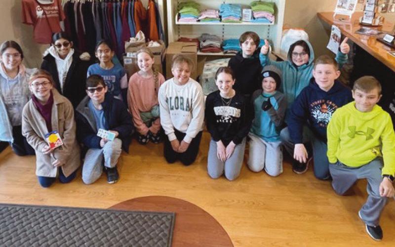 Hull Prairie Intermediate School Roots and Shoots Service Club members delivering their donations at Nature’s Nursery.