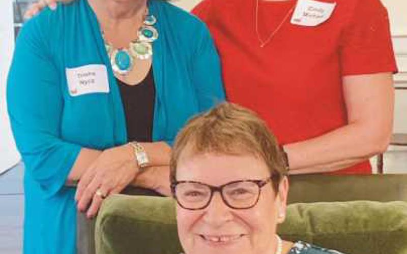 Standing from left, Red Wagon Luncheon co-chairs Tricia Nycz, a Perrysburg resident, and Cindy Michael; seated is CCS retiring new member advisor Mary Goodwin. Nycz and Michael were both awarded with the Barbara Sommer memorial award for their significant contributions of time and talent as new members.