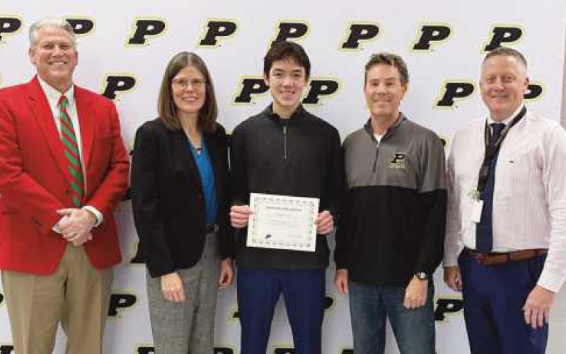 Superintendent Tom Hosler, Board Member Susan Rowland Miller, Anthony Clark, Coach Keith Madaras and PHS Principal Aaron Cookson