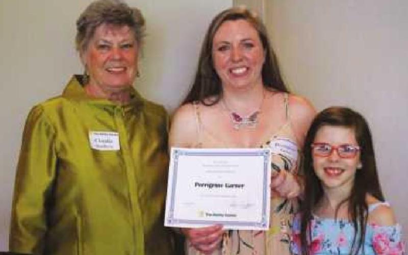 The Ability Center is accepting scholarship applications through March 31. Pictured are, from left, Claudia Sunberg, Perrigrine Garner and Deliah.