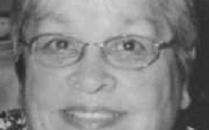 MINNIE E. KARR