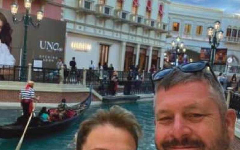 Above, Michelle and Todd Sanford on a recent trip to Las Vegas, and above right, Michelle in the Lamplight Cafe holding a letter written by her husband in 1987.