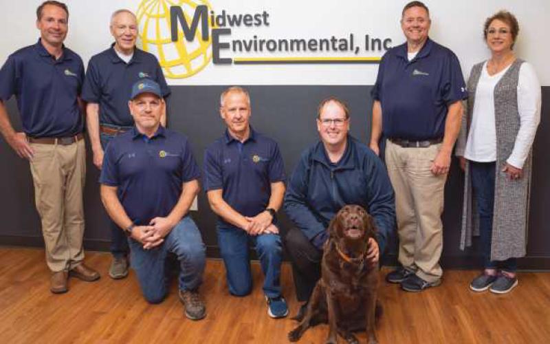 Pictured are, standing from left: David Bruhl, Dale Bruhl, Jr., Dan Wilburn, Lisa Sekela. Kneeling from left: Frank Montgomery, Scott Sellers, Justin Reitz, and Darcy the company mascot.