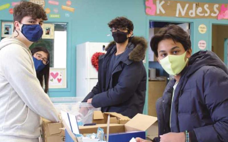 Islamic Food Bank volunteers included, from left, Aidan McGann, Alia Ahmad, Omar Asad and Emmadi Ali.