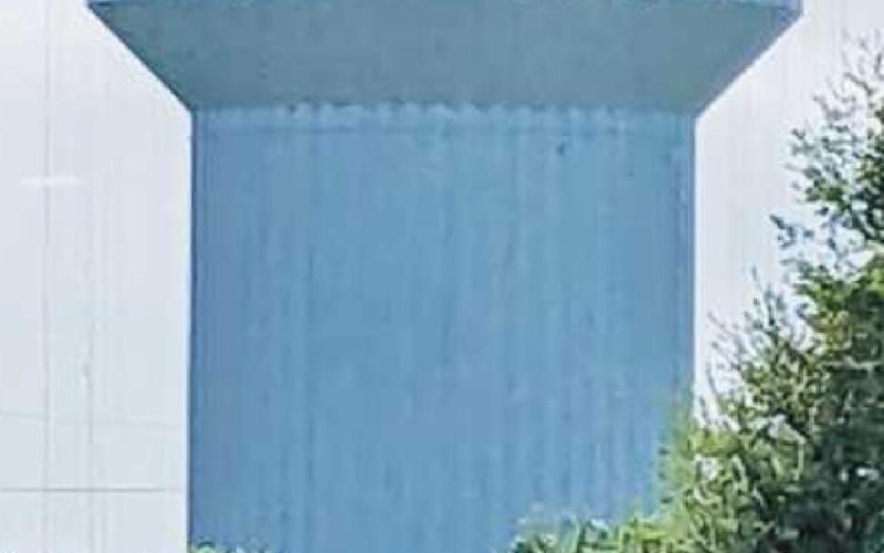 Seven Brothers Painting begins the process of repainting the water tower off State Route 199. The tower’s signature silhouette has come under dispute in recent weeks.