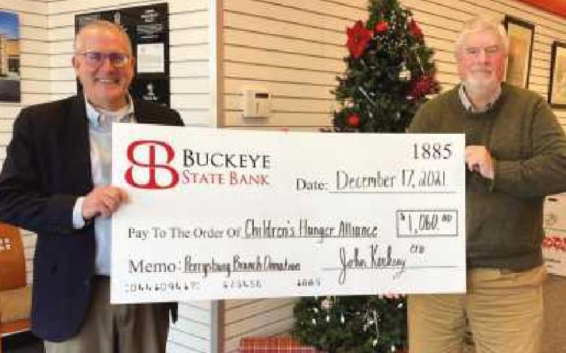 Jeff Langenderfer, left, vice president, senior retail leader at Buckeye State Bank and James Harter, Northern Regional development director for the Children’s Hunger Alliance.