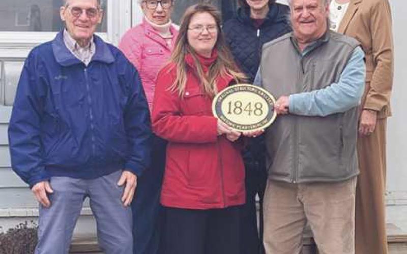back, Mary Merrick, Joanie Graver and Joy Studer; front, Grant Garn, Sarah Rumple and Dave Kleeberger. Historic Perrysburg distributes the plaques to home owners with a home that is 100 years or older. The application can be found at historicperrysburg.org. There is a small processing fee associated with the plaque.
