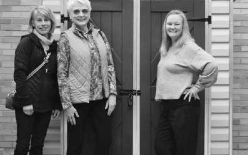 From left, are Kim Frazier and Kathy Attwood of Country Garden Club, and Dr. Shannon Kathryn Orr, political science professor and director of the Falcon Food Pantry. They are standing in front of the garden shed funded by a CGC grant. The shed is located near four small and two large raised-bed gardens. These gardens provide access to fresh produce for students to pick as they want.