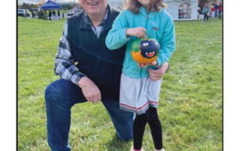 Above: Lena Coulson (right), pictured with her grandfather and Perrysburg Rotarian Mark Weber (left), displays her painted pumpkin from last year’s event. Below: BGSU mascot Freida Falcon (along with Freddie) will once again participate in the pumpkin races.