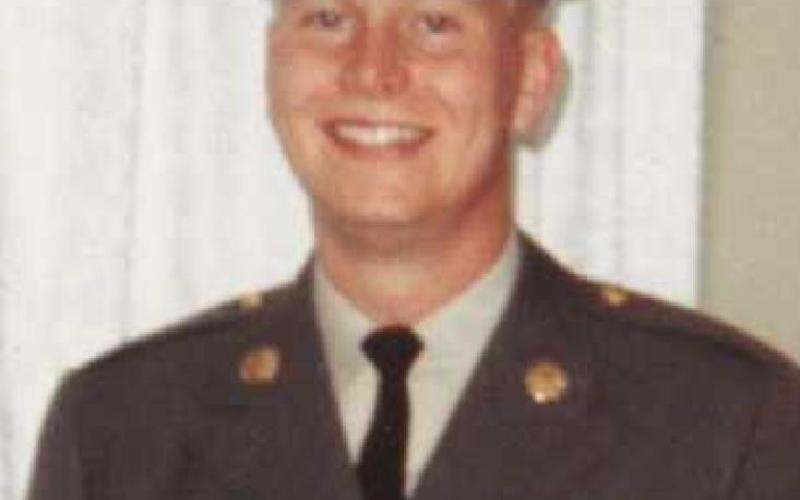 At left, Jerry Bockbrader at basic training in Fort Jackson, South Carolina in 1967. At right, photo taken while at home on leave Christmas 1967. On his uniform is a marksmanship badge.