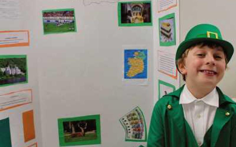 Saint Rose third graders recently held a culture day. Each student researched a country of his or her choice, then created a poster board display and presentation of the facts they discovered while doing their research. Parents and friends were invited to hear their presentations and to sample food from around the world. Pictured are some of the third graders at the event.