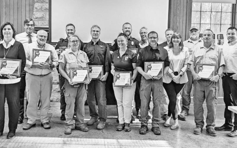 Metroparks commissioners and executive director Dave Zenk recognize employees for attaining milestone anniversaries with the park district.