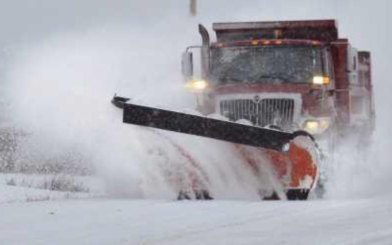 A Perrysburg Township snowplow clearing the street.