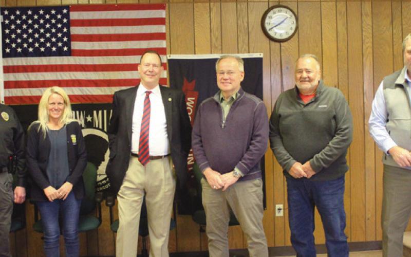 Above from left are Police Chief Mark Hetrick; Kelly Moore, zoning inspector; Walt Celley, retiring administrator; Trustees Bob Mack and Joe Schaller, and Jon Eckel, new administrator.