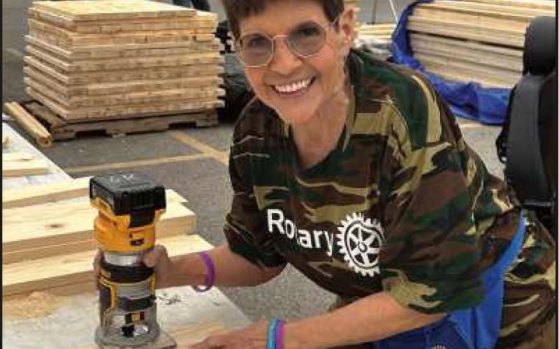 Rotarian Maris Brenner at a Sandusky. recent build beds event in