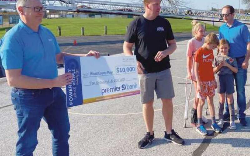 From left: John Eckel, vice president, senior commercial lender, Premier Bank; Ryan Wichman of Perrysburg, president, Wood County Plays; Maya Burris, Jack Burris, Faith Burris and Justin Burris, vice president, commercial lender, Premier Bank.