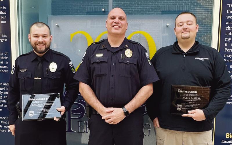 Pictured from left, Officer Jordan Gregory, Police Chief Patrick Jones and Bailey Malear