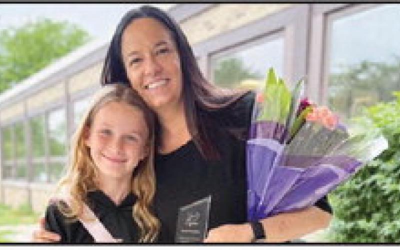 Award winner Brandi Menchhofer, right, with student, Kennedy, who nominated her.