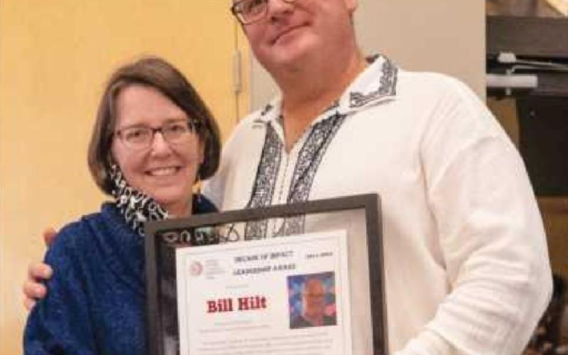 Dr. Nancy Patterson, toastmaster for the awards ceremony and BGSU professor, presented Bill Hilt with the Decade of Impact Leadership Award.